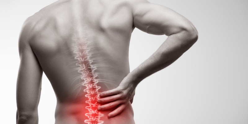 The image illustrates a man with lower back pain.